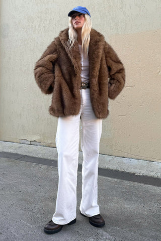 spell-womens-camille-coat-in-golden-brown-recycled-polyester-faux-fur-with-wide-collar-styled-by-a-model