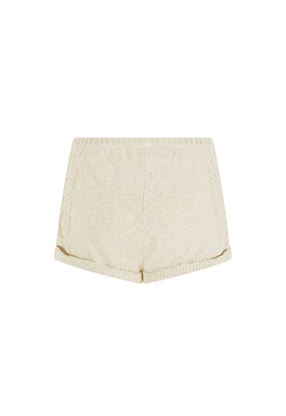 Cream-colored knit shorts with a ribbed waistband and hem, shown flat against a white background.