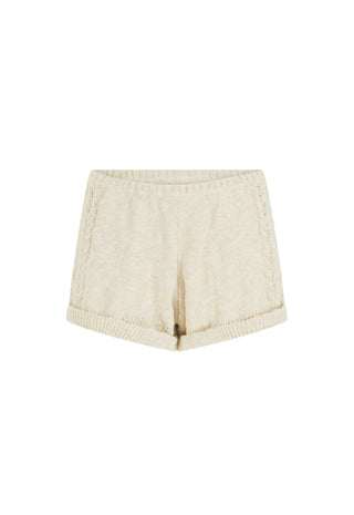 Cream-colored knit shorts with a ribbed waistband and hem, displayed flat against a white background.